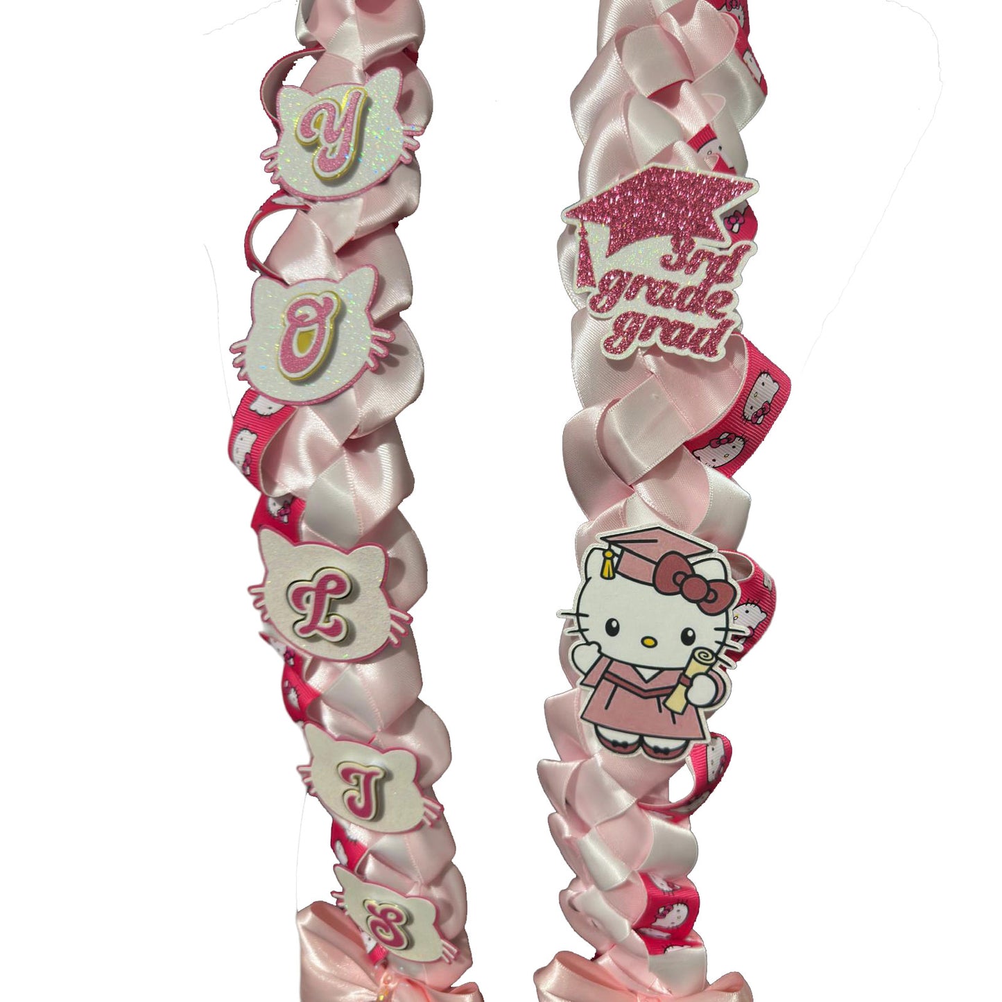 Close-up detail of a handmade pink and white ribbon graduation lei, showing custom glitter lettering, a "3rd Grade Grad" cap cutout, and character accent details.