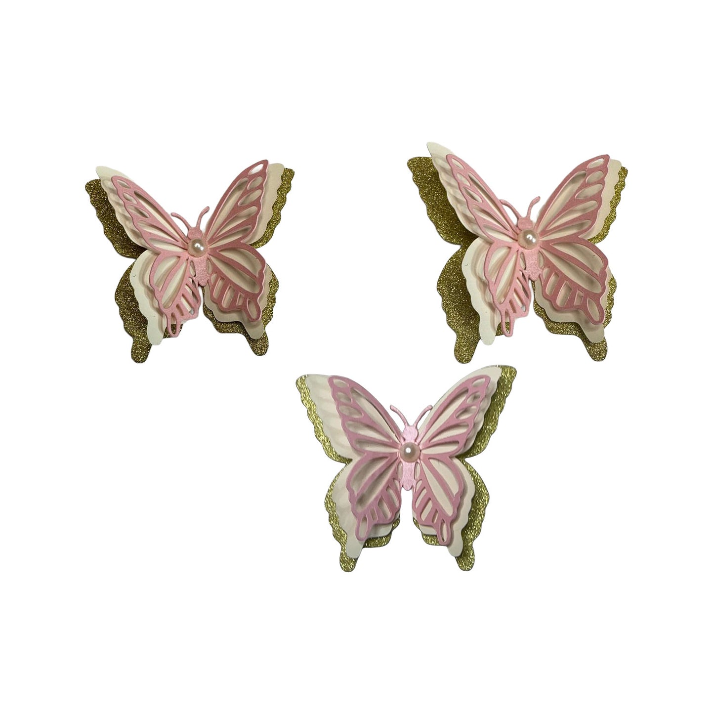 A coordinated set of three 3D butterfly spirit cutouts crafted with Shimmer Pink, Glitter Ivory, and Glitter Gold layers and a pearl center.