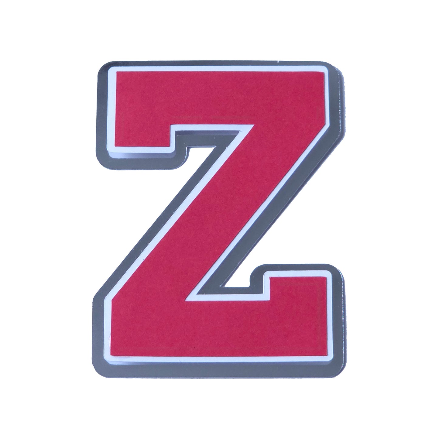 Red, white, and silver foil layered cardstock letter 'Z' cutout in a classic varsity block font for homecoming mums and graduation leis.