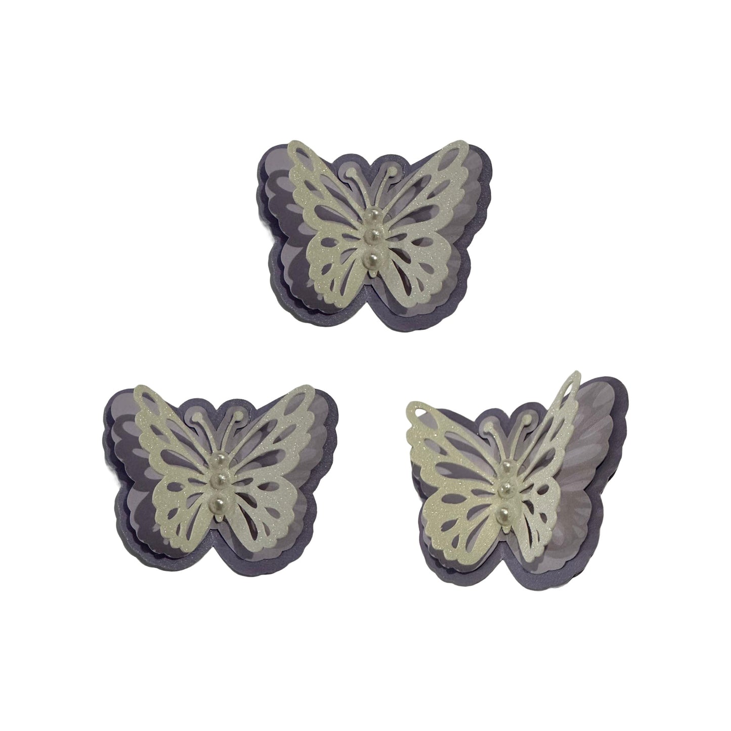 Coordinated set of three 3D Shimmer Lavender and White Glitter butterfly spirit cutouts with iridescent pearl accents for custom homecoming mums and graduation leis.