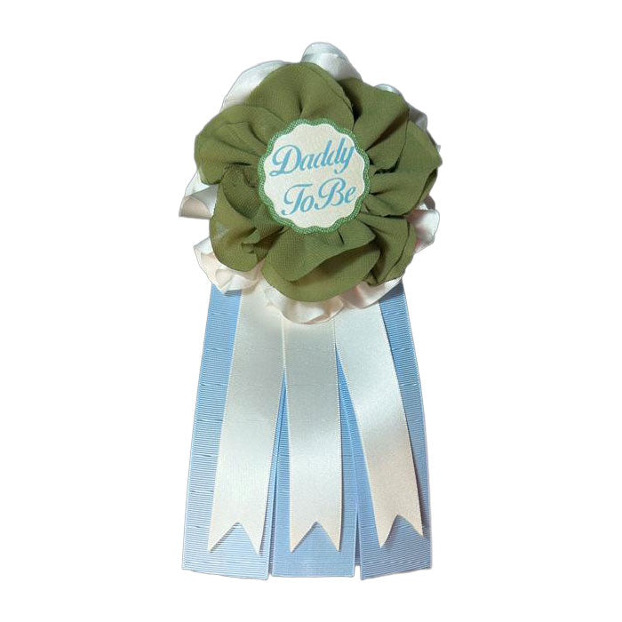 Daddy-to-Be award ribbon pin with a hunter green chiffon flower and light blue and white hanging ribbons.