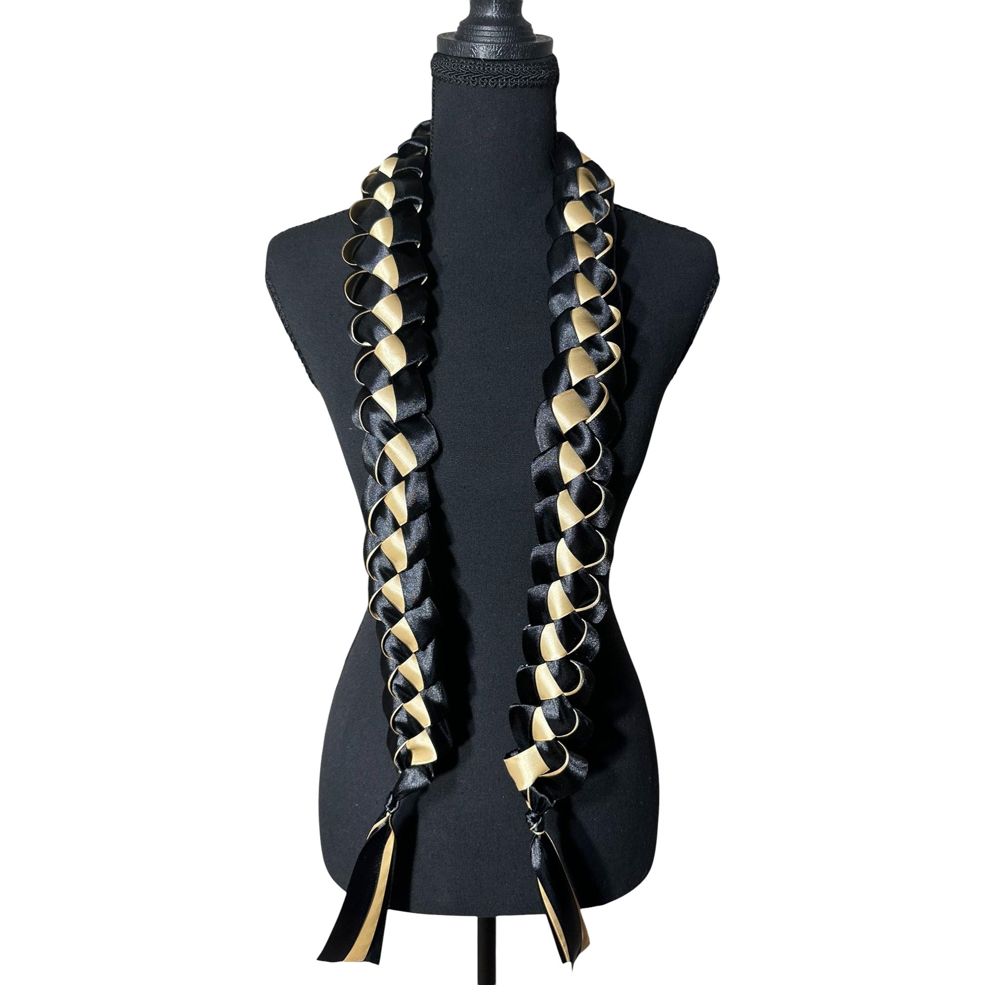 Handwoven black and gold satin ribbon graduation lei with single military braid texture.