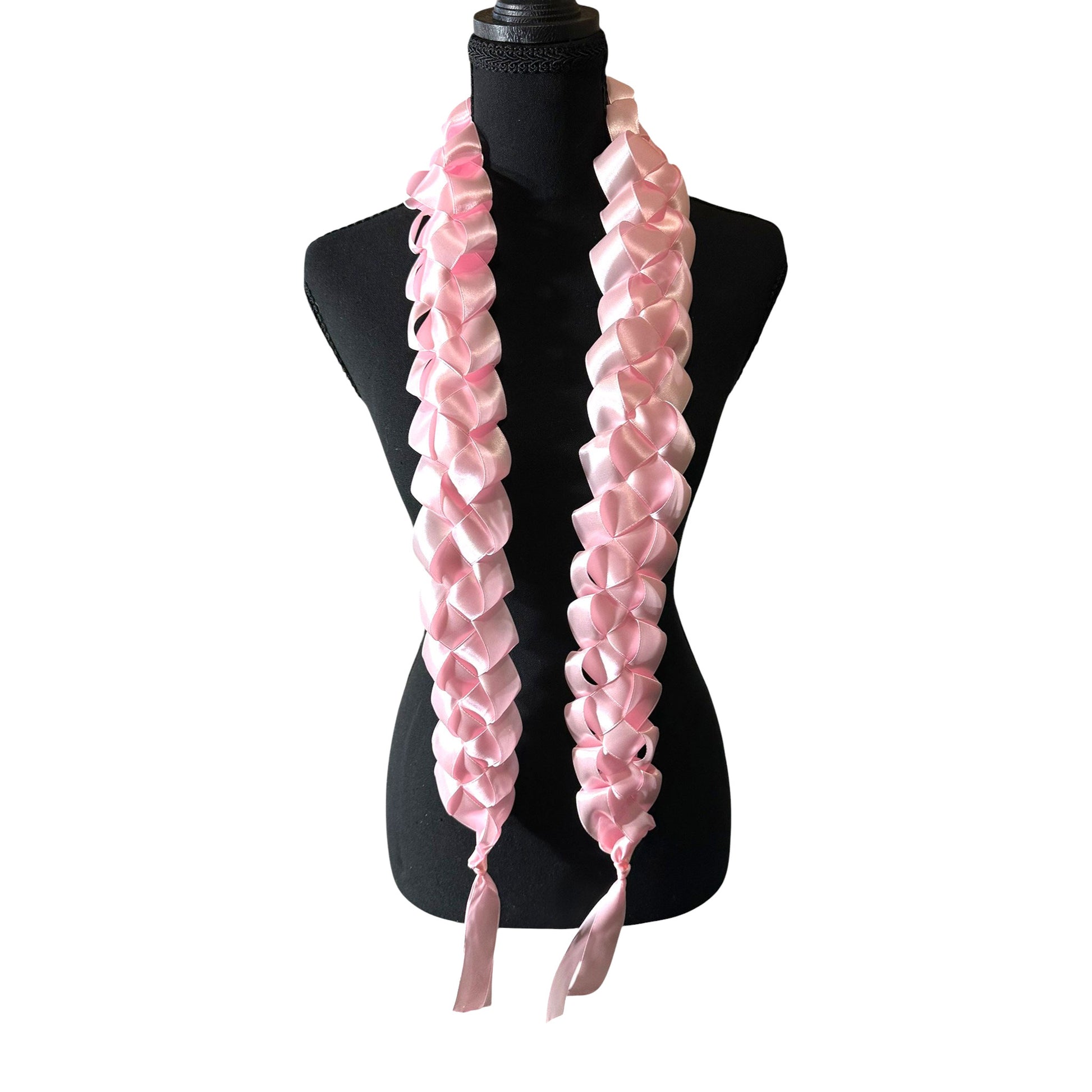 Handwoven solid light pink satin ribbon graduation lei with single military braid texture on mannequin.