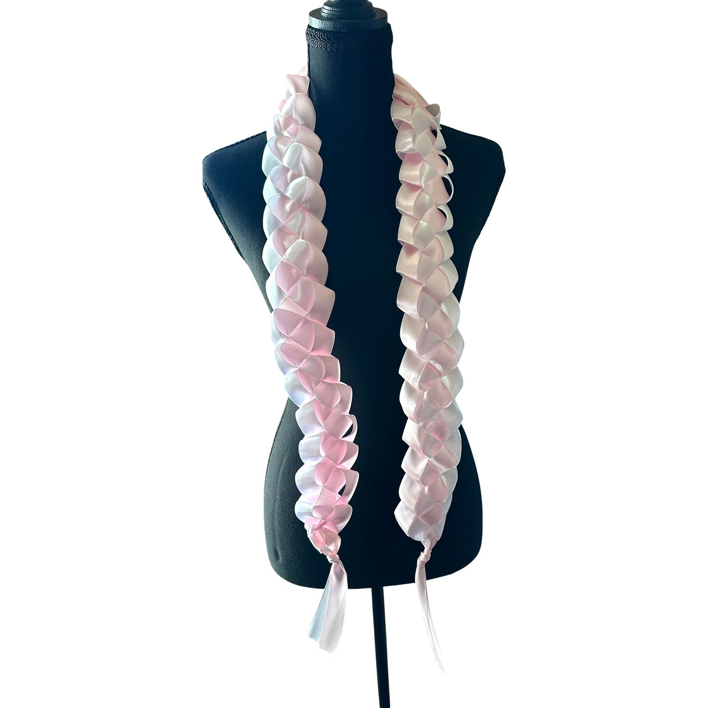 Handwoven light pink and white satin ribbon graduation lei with single military braid texture on mannequin.