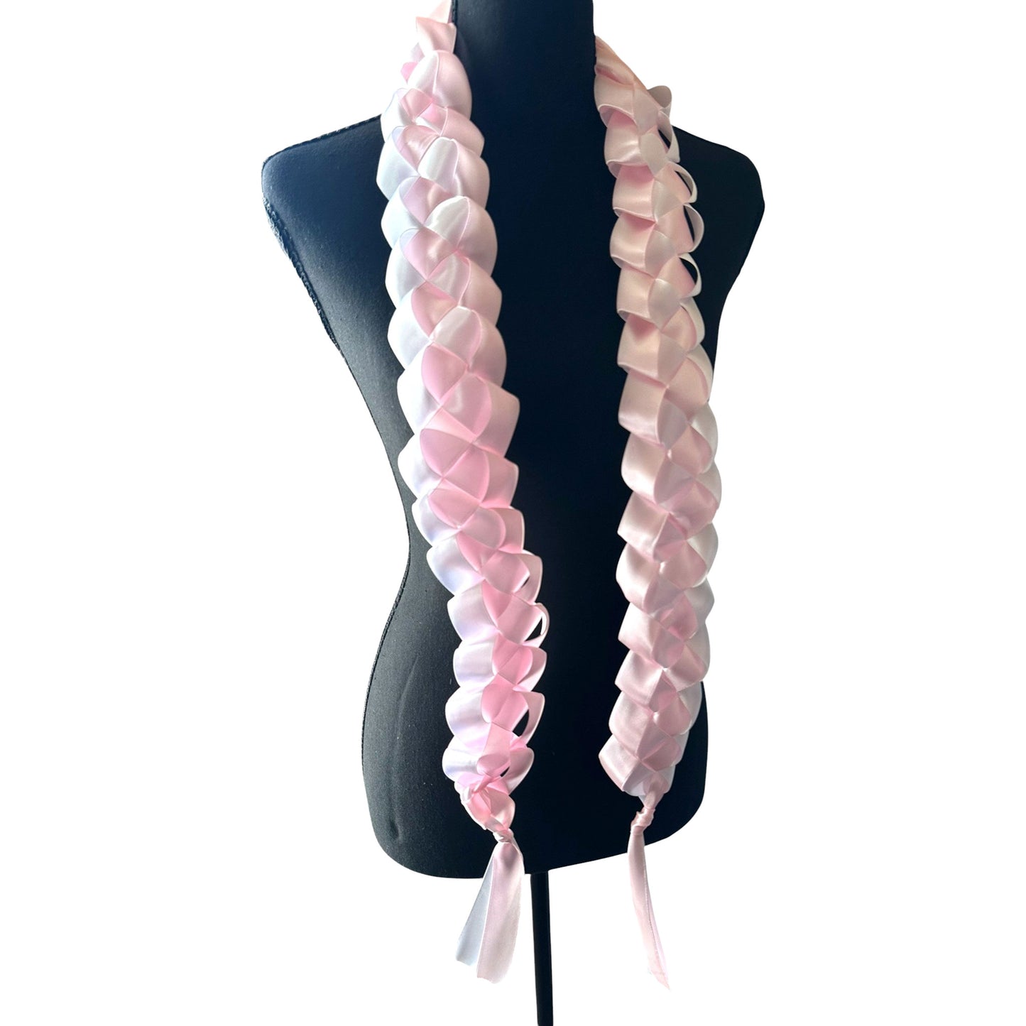 Handwoven light pink and white satin ribbon graduation lei with single military braid texture on mannequin.