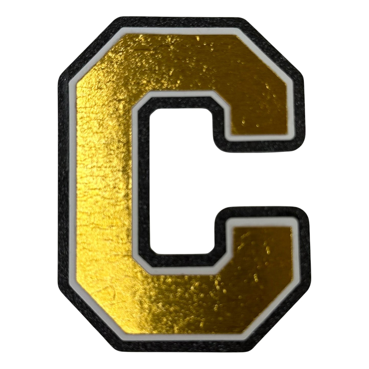 Black white and gold foil layered cardstock letter C cutout in varsity font for homecoming mums and graduation leis.