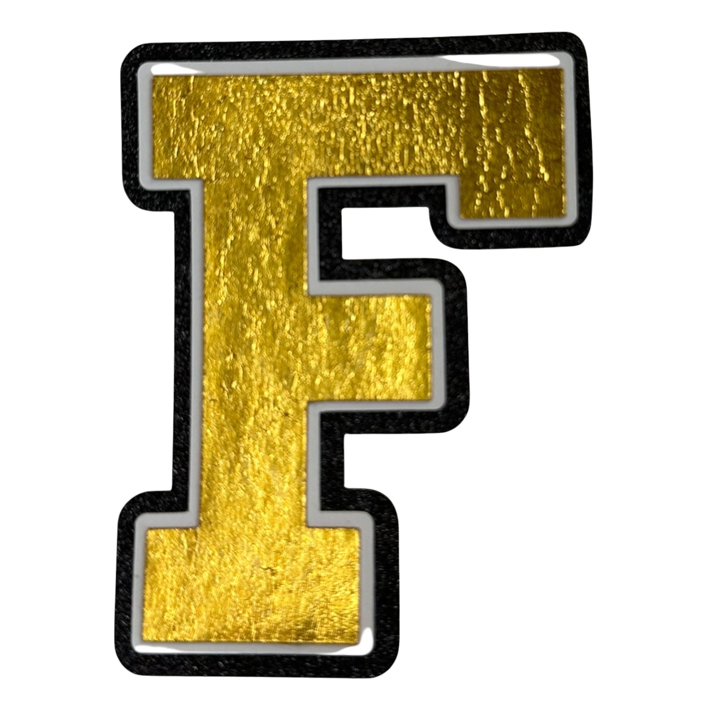 Black white and gold foil layered cardstock letter F cutout in varsity font for homecoming mums and graduation leis.