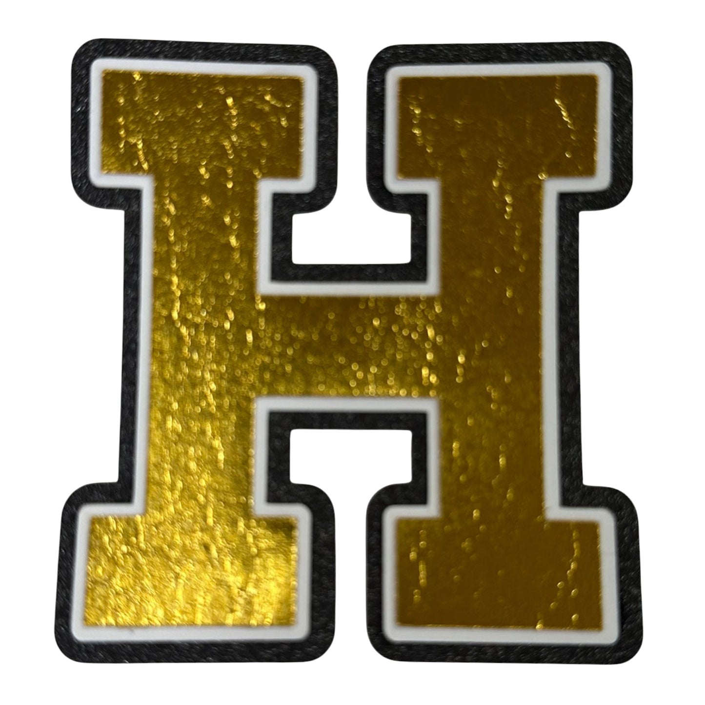 Black white and gold foil layered cardstock letter H cutout in varsity font for homecoming mums and graduation leis.