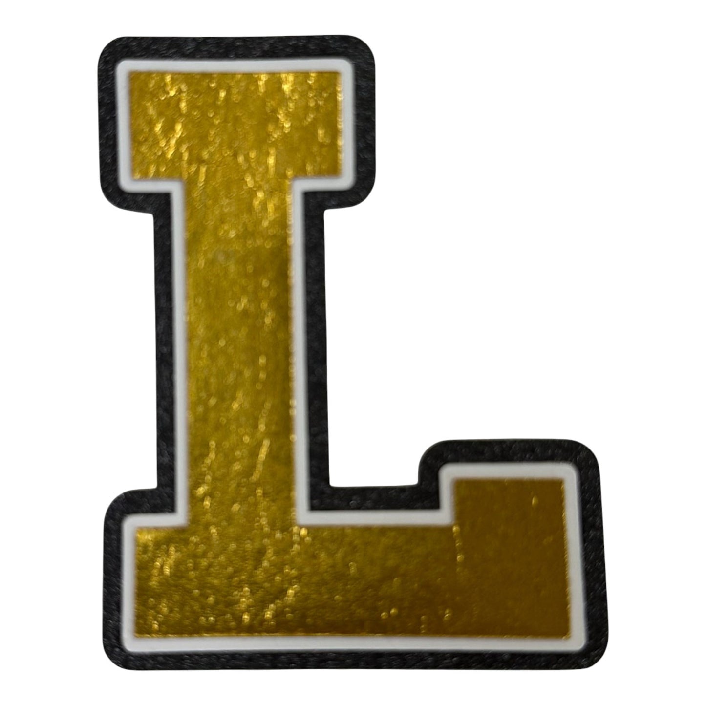 Black white and gold foil layered cardstock letter L cutout in varsity font for homecoming mums and graduation leis.