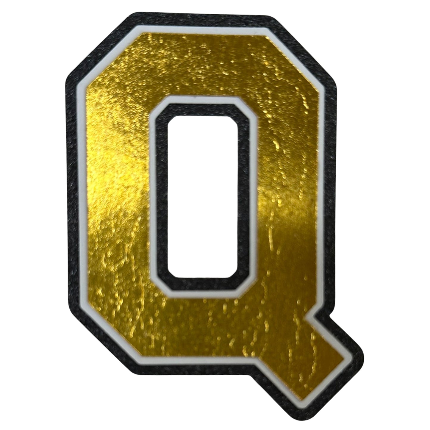 Black white and gold foil layered cardstock letter Q cutout in varsity font for homecoming mums and graduation leis.