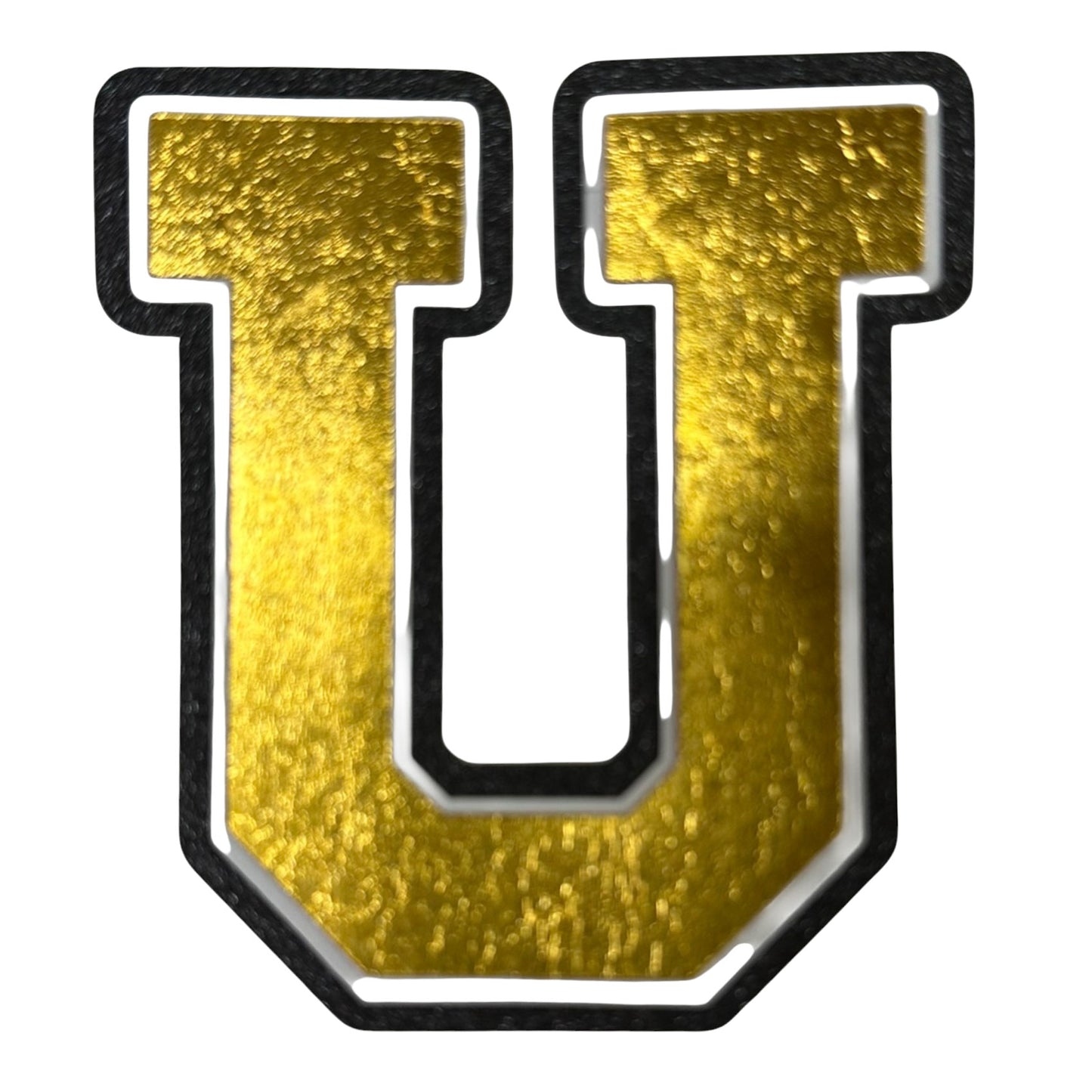 Black white and gold foil layered cardstock letter U cutout in varsity font for homecoming mums and graduation leis.