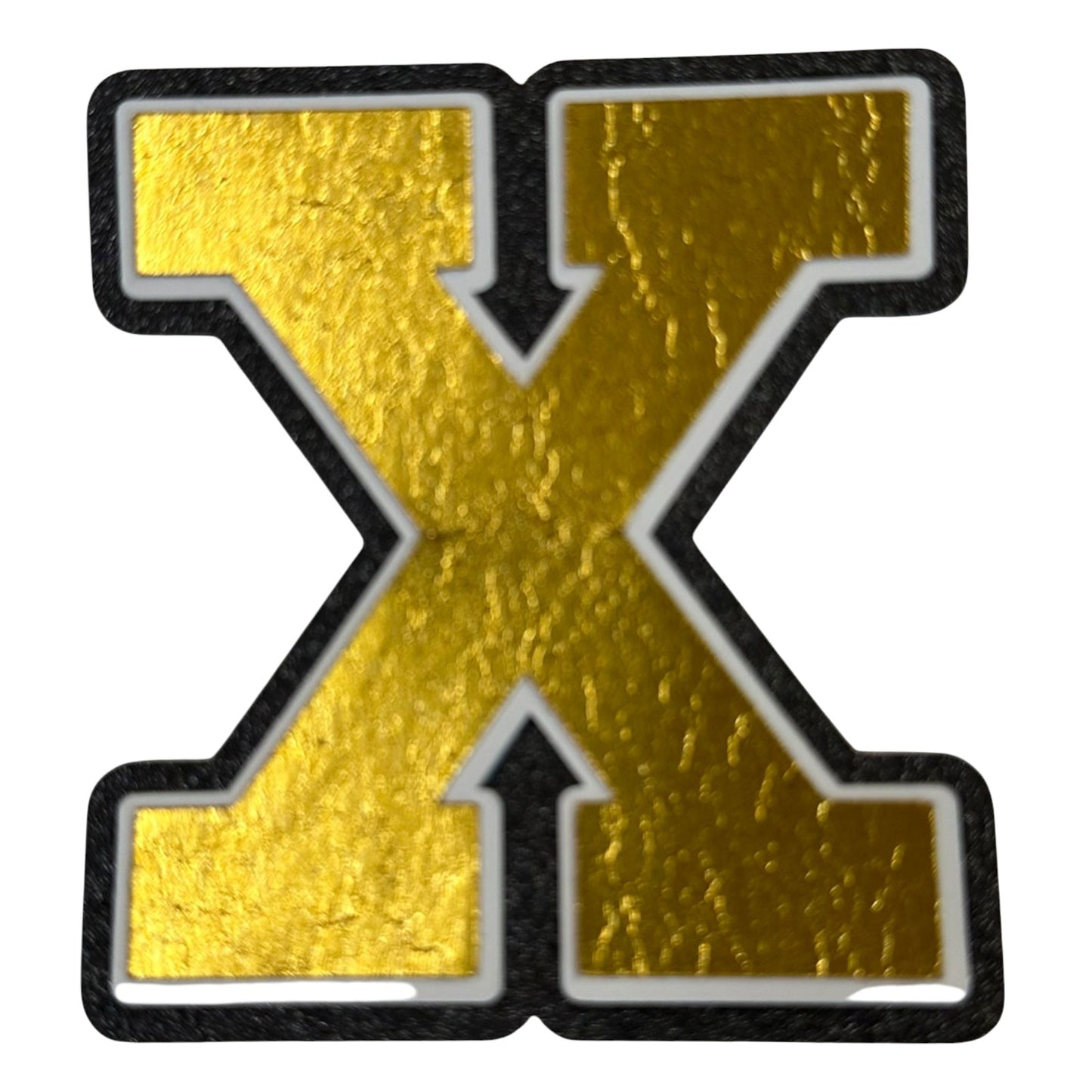 Black white and gold foil layered cardstock letter X cutout in varsity font for homecoming mums and graduation leis.