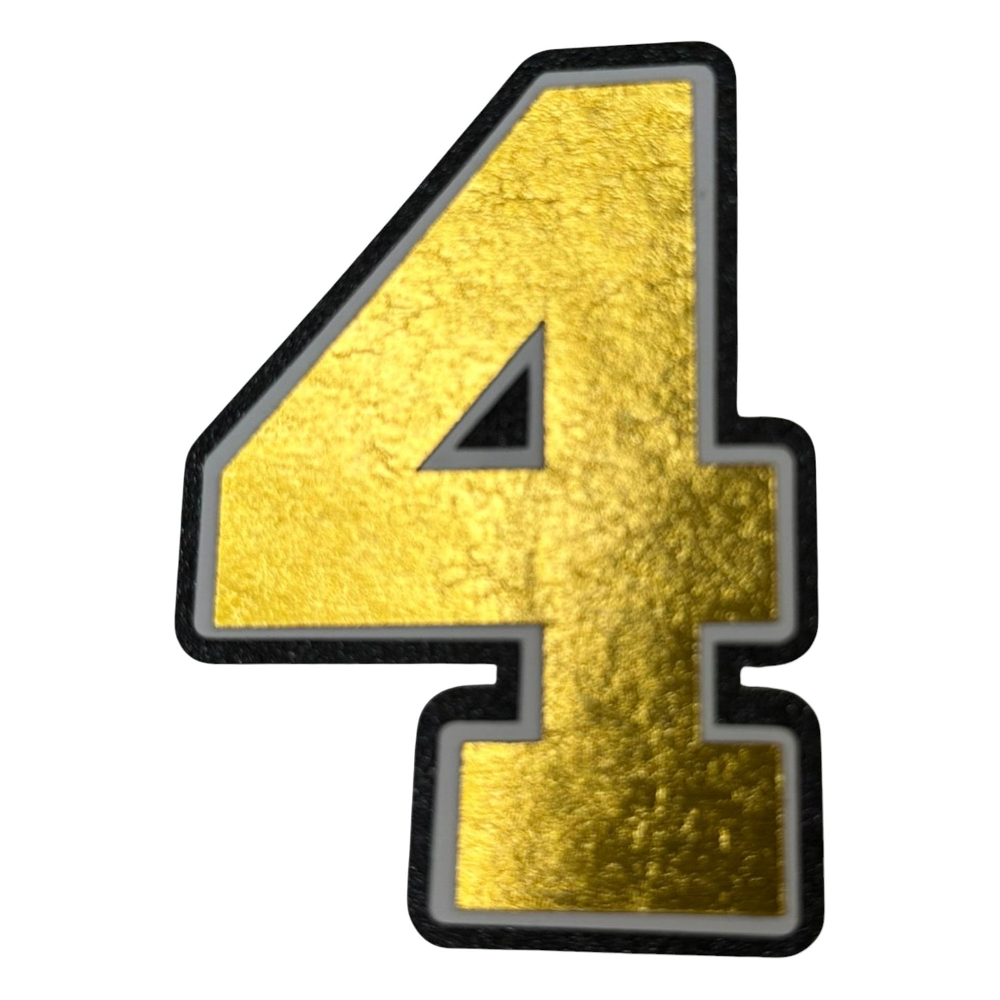 Black white and gold foil layered cardstock number 4 cutout for graduation year and jersey numbers.