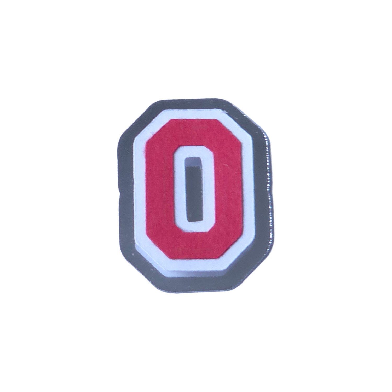 Red, white, and silver foil layered cardstock number '0' cutout in a varsity block font for homecoming mums and graduation leis.