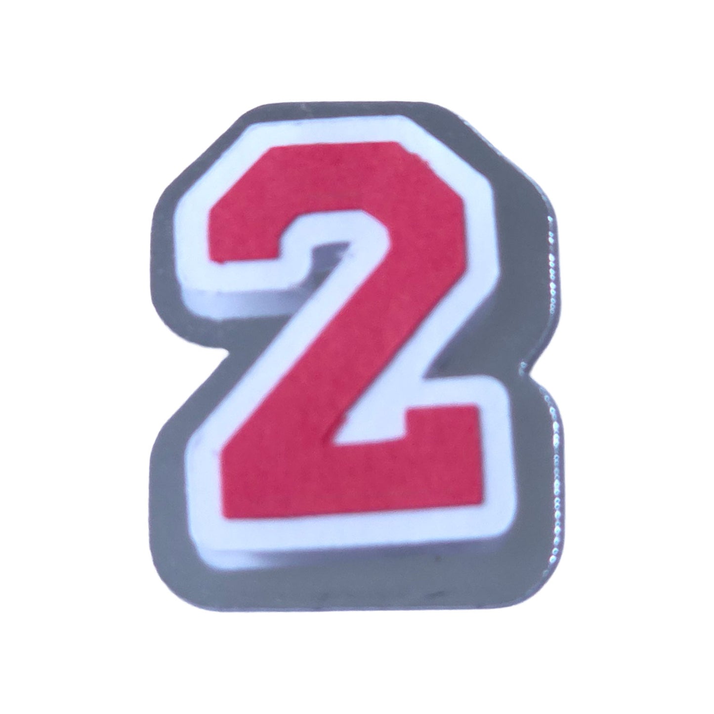 Red, white, and silver foil layered cardstock number '2' cutout in a varsity block font for homecoming mums and graduation leis.