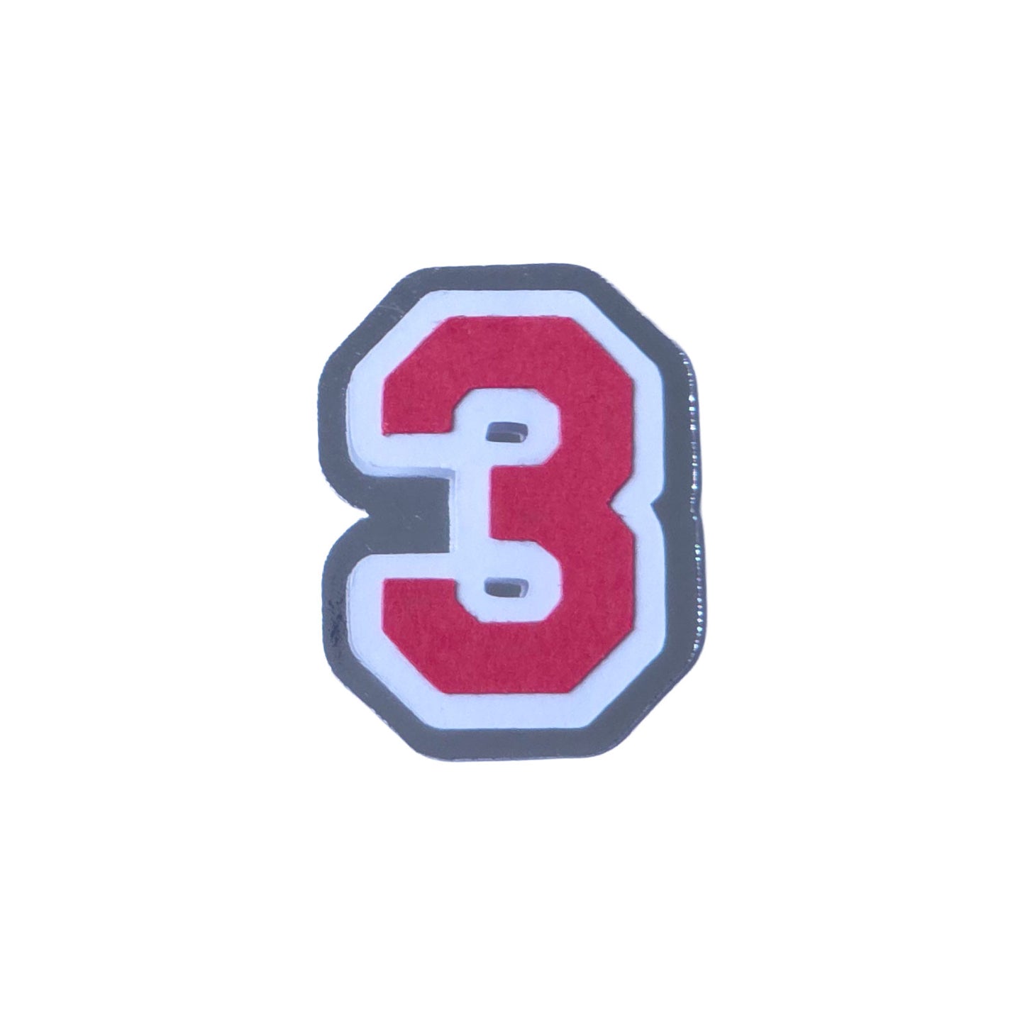 Red, white, and silver foil layered cardstock number '3' cutout in a varsity block font for homecoming mums and graduation leis.