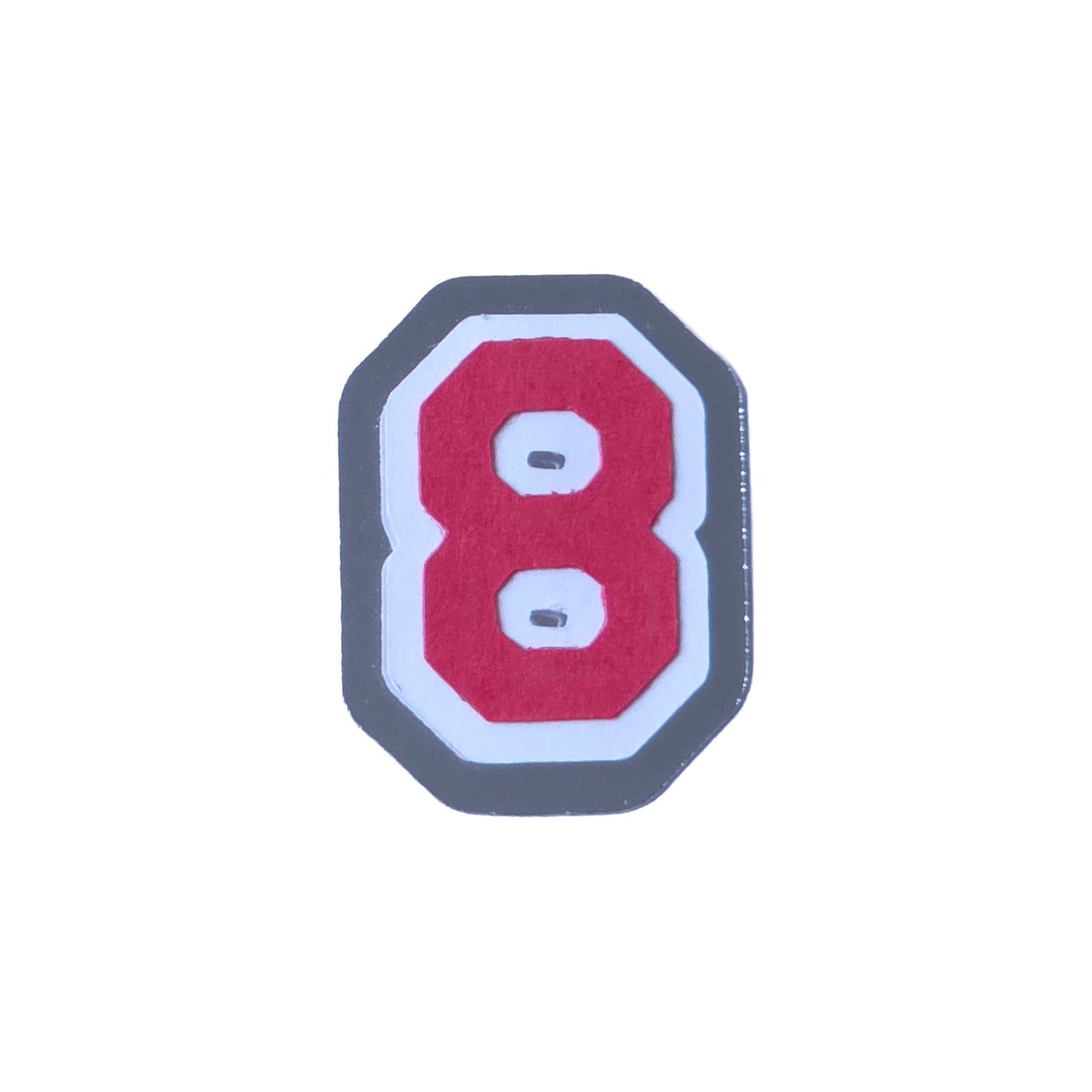 Red, white, and silver foil layered cardstock number '8' cutout in a varsity block font for homecoming mums and graduation leis.