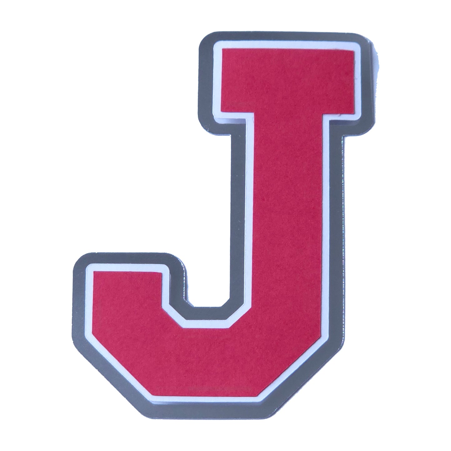 Red, white, and silver foil layered cardstock letter J cutout in a classic varsity block font for homecoming mums and graduation leis.